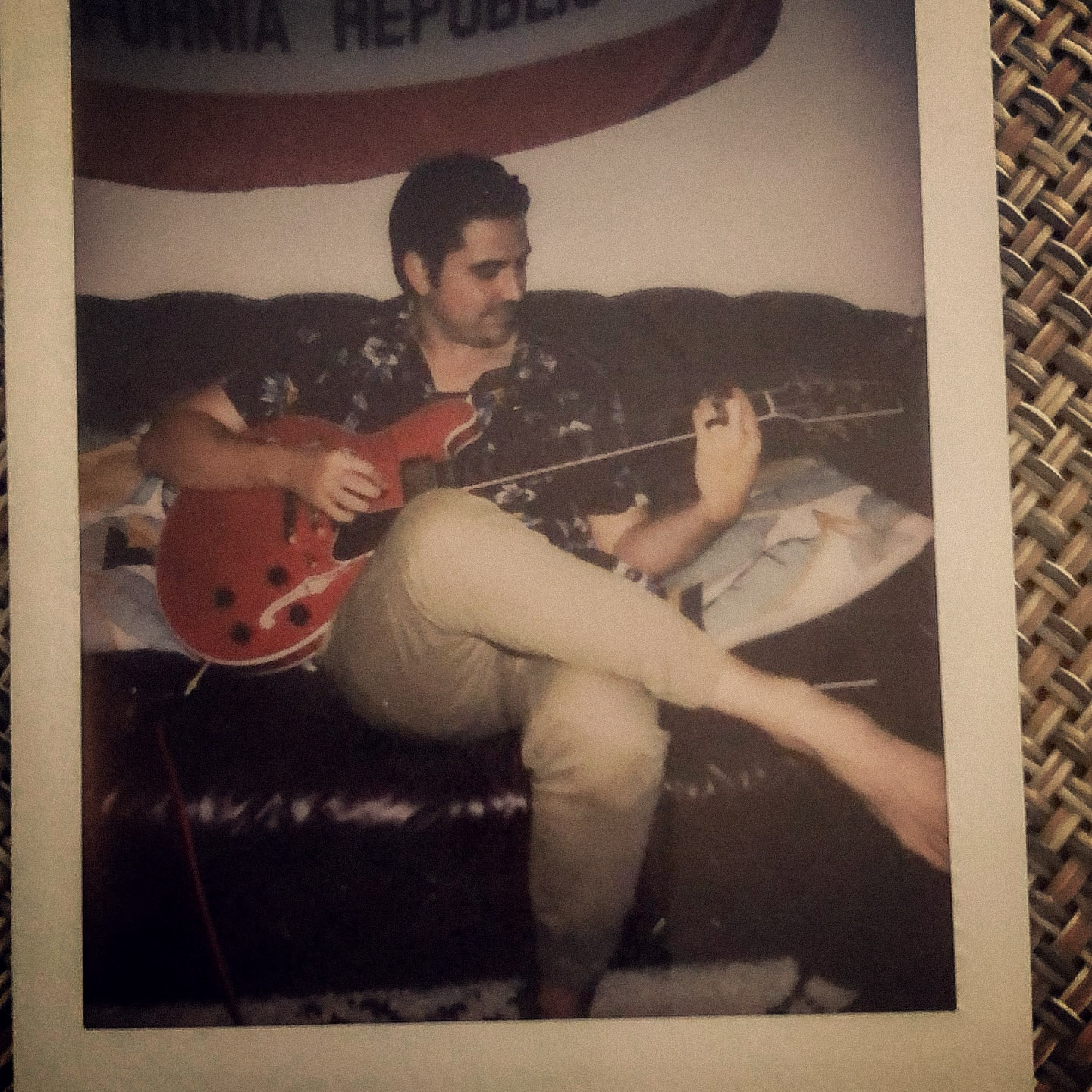 Niko playing guitar, polaroid